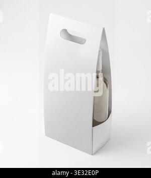 Mockup of a white paper bag for a wine bottle, isolated on a white background. Stock Photo