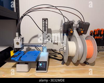 modern 3d printer creating custom parts with filament, concept of innovation and production. Stock Photo