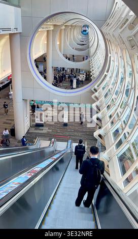 San Diego, CA - Mar 17, 2026: Attendees on escalators at TMS 2026 Annual Meeting, San Diego Convention Center. Modern architecture and glass roof. Stock Photo