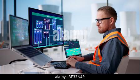 Engineer Diligently Oversees SCADA Operations Managing Nuclear Energy Plant Systems Stock Photo
