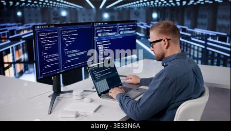 IT Professional Managing Cloud Data Protection In A High-Tech Server Facility Stock Photo