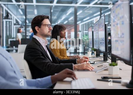 Young Designer And Developer Collaborating On App Interface Design. People Working Together On User Experience Stock Photo