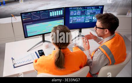 Engineer Supervises Industrial SCADA System For Power And Fuel Management Stock Photo