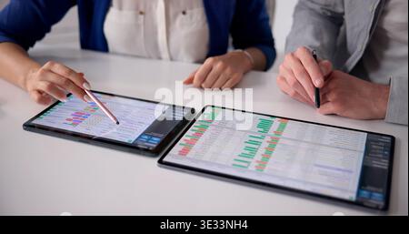 Healthcare Coder Analyzing Billing Data On A Tablet Device Stock Photo