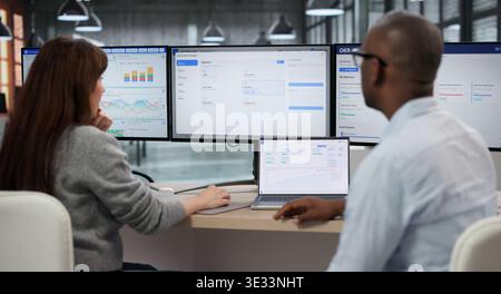 Two Managers Collaborate Online, Analyzing Real-time Data On Programmatic Ad Platform Stock Photo