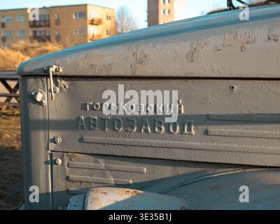 Close-up of embossed Cyrillic text Gorky Automobile Plant on aged Soviet GAZ truck hood, Estonia Stock Photo