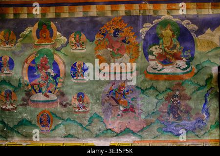 Top centre: Gyalpo Pehar (Pehar Gyalpo). Top Right: Vaisravana (Jambhala) sitting on a snow lion and holding a mongoose in his left hand. Bottom centr Stock Photo