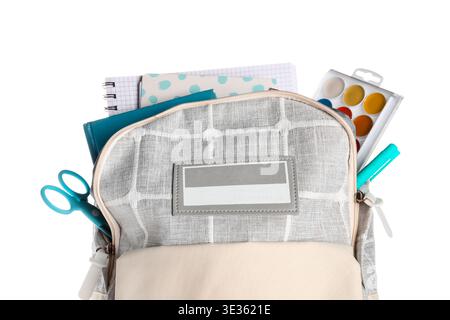 Grey school backpack with notebooks and watercolors on white background Stock Photo