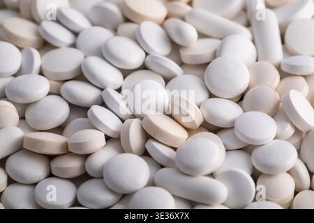 Heap of medicine white pills macro shot Stock Photo