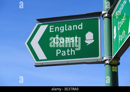 Green, metal footpath signs for the newly designated King Charles III English Coast Path Stock Photo
