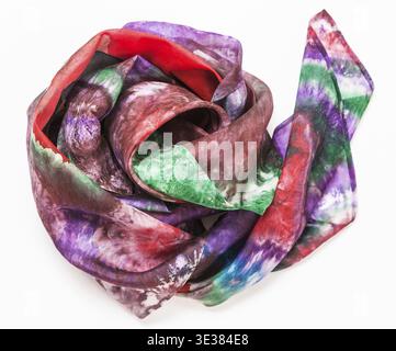 Crumpled hand painted batik silk headscarf with abstract pattern on white background Stock Photo