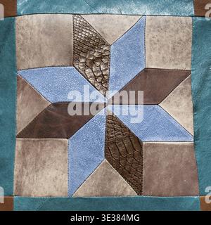 Stitched star pattern from leather pieces on decorative pillow Stock Photo