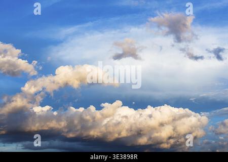 Cumuli clouds in dark blue sky over Moscow in summer evening Stock Photo