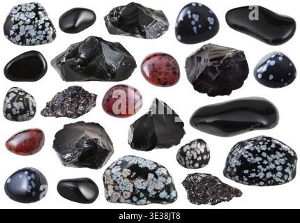 Set of various natural obsidian mineral stones and gemstones, against a white background Stock Photo