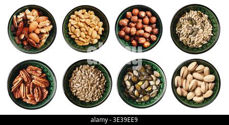 Assorted nuts and seeds in bowls isolated on white background. Healthy snack collection and natural food ingredient assortment closeup. Stock Photo