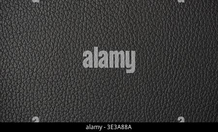 Black leather surface displaying a detailed and textured material background Stock Photo