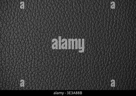 Black leather surface displaying a detailed and textured material background Stock Photo