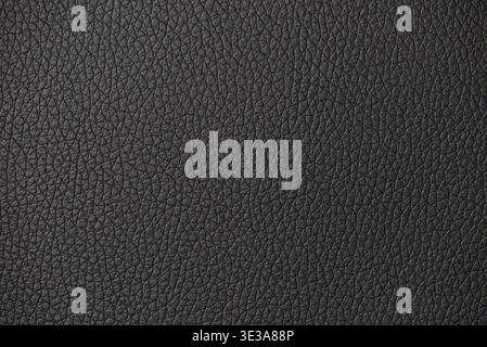 Black leather surface displaying a detailed and textured material background Stock Photo