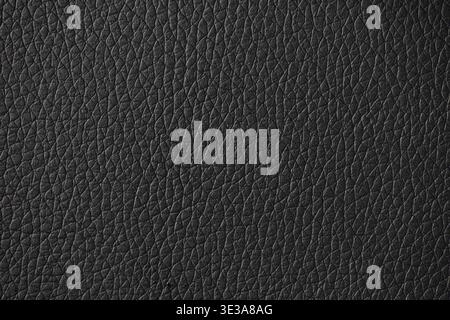 Black leather surface displaying a detailed and textured material background Stock Photo