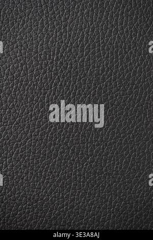 Black leather surface displaying a detailed and textured material background Stock Photo