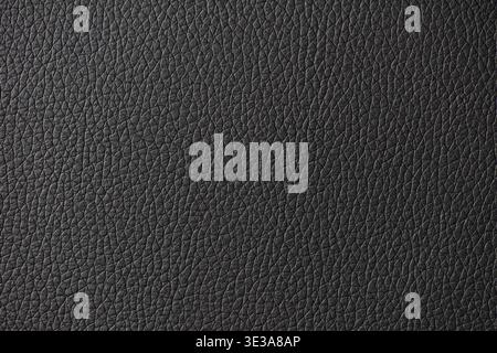 Black leather surface displaying a detailed and textured material background Stock Photo
