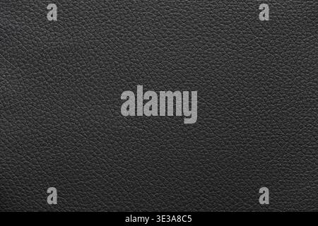 Black leather surface displaying a detailed and textured material background Stock Photo