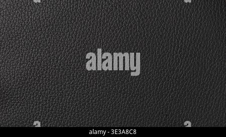 Black leather surface displaying a detailed and textured material background Stock Photo