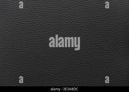 Black leather surface displaying a detailed and textured material background Stock Photo