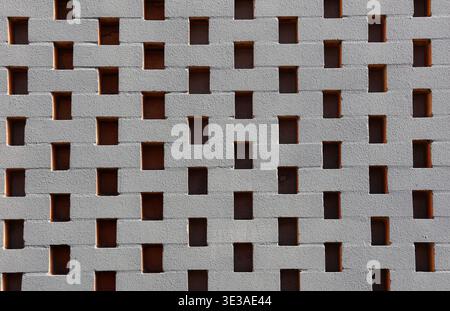 Brick wall with rectangular openings abstract textured background Stock Photo