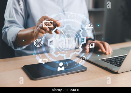User interacting with global process interface above tablet and laptop, representing business operations, workflow optimization, strategic planning, a Stock Photo