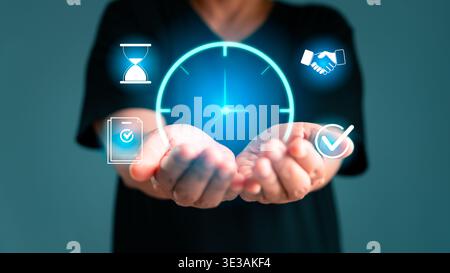 Hands holding luminous clock with task and approval icons, illustrating time management, deadline control, workflow planning, business coordination, p Stock Photo