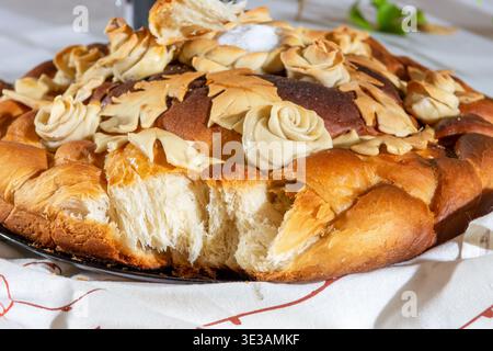 Bread with traditional decorations eaten on the table at the festival. Loaf wedding cake close-up Stock Photo