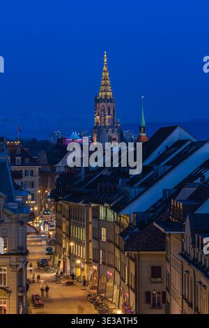 Bern, Switzerland - March 04.2026: The Munster church tower over the old town district at twilight, Bern, Switzerland Stock Photo