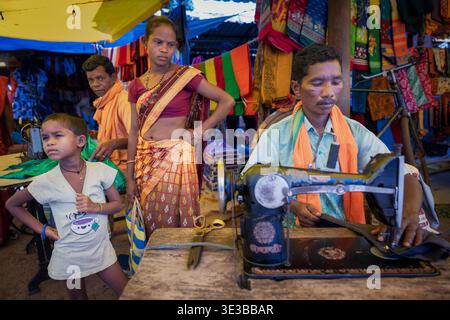 India tailor working at a local market in rural Odisha, India, Asia Stock Photo