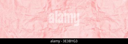 Coral color crumpled kraft old paper wide panoramic texture. Pastel pink orange wrinkled craft paper sheet surface. Abstract light vintage background Stock Photo
