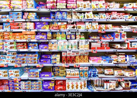 Packets of Granola, Nutella, Chabrior and Milka biscuits on sale at InterMarche supermarket - Yzeures-sur-Creuse, Indre-et-Loire (37), France. Stock Photo