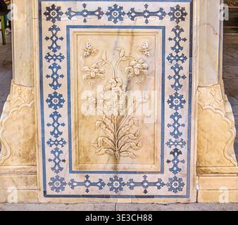 Jaipur, India, 19.02.2020. Beautiful intricate marble floral relief carving and inlaid patterns on the walls of Amber Fort, a UNESCO World Heritage si Stock Photo