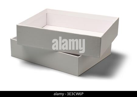 two empty white cardboard boxes isolated white background, smooth matte paper finish containers stacked, mock-up template with shadows Stock Photo