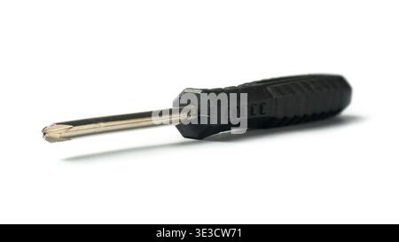phillips head screwdriver isolated white background, black textured plastic handle with worn metal shaft, mock-up template side view in soft focus Stock Photo