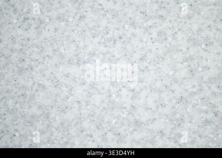 Soft fresh snow texture covering the ground in a winter close-up background Stock Photo