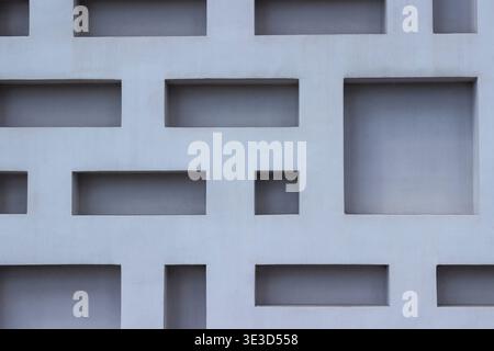 A blueish colored patterned concrete wall. Background Stock Photo