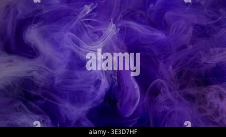 Paint cloud. Ink vapor. Defocused purple blue color glitter fog splash shimmer water fume smoke spreading on abstract art background. Stock Photo