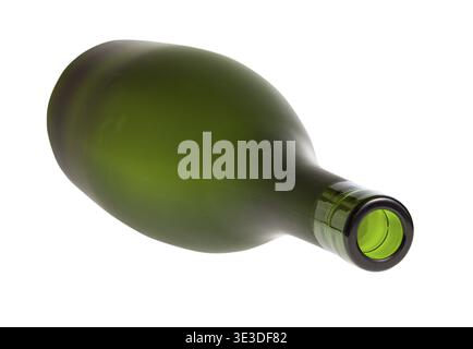 Overturned empty green brandy bottle against white background Stock Photo