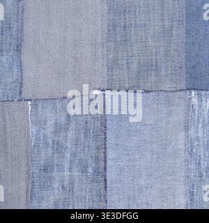 Patchwork square textile background from old denim flaps Stock Photo