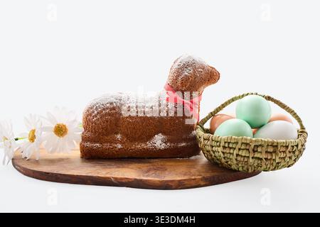 Easter lamb cake with colored eggs and flowers Stock Photo