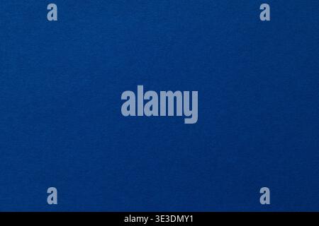 Deep blue textured paper background with copy space for modern design projects Stock Photo