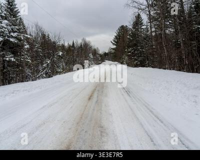 A snow covered rural road in Rawdon,Quebec,Canada Stock Photo