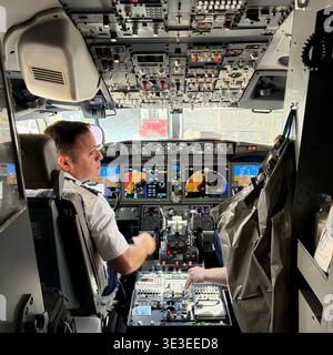 A pilot prepares for takeoff in a jet, Stock Photo