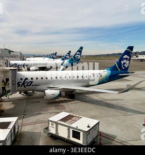 Alaska Airline planes are lined up at gates at the Portland, Oregon airport. Stock Photo