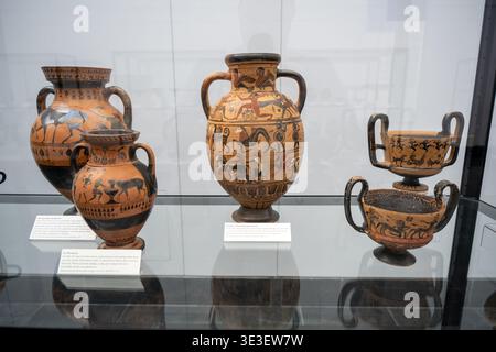 Munich, Germany - 30 Mar 24: Black-figure Greek terracotta vessels displayed in a glass case at the Staatliche Antikensammlungen, Munich, Bavaria, Ger Stock Photo